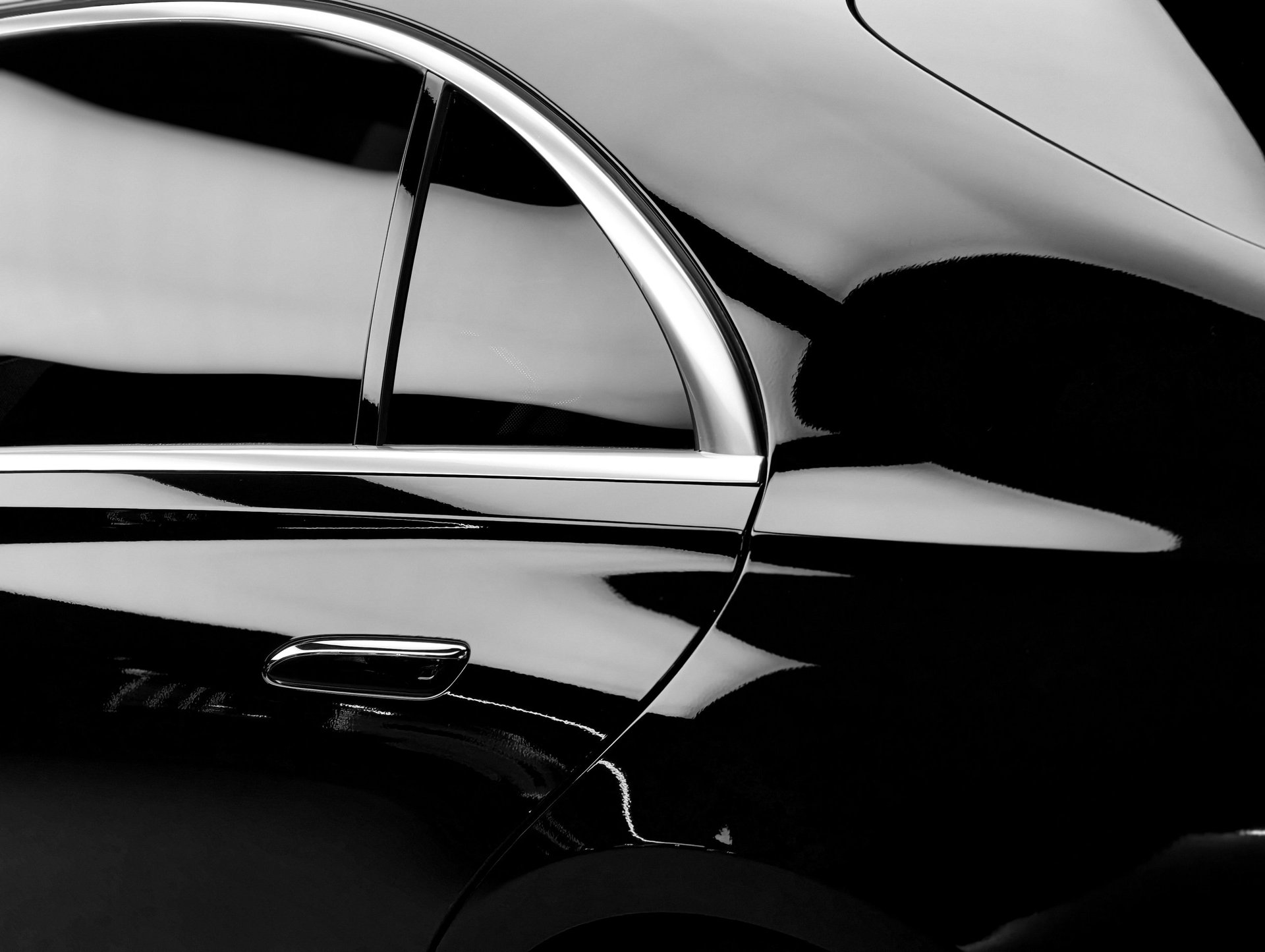 Luxury car with polished surface reflecting elegant curves and chrome accents